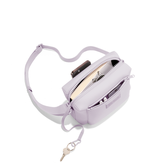 Dagne Dover Micah Crossbody in a soft purple with grey undertones seen from above, showing the interior air mesh pocket. hover
