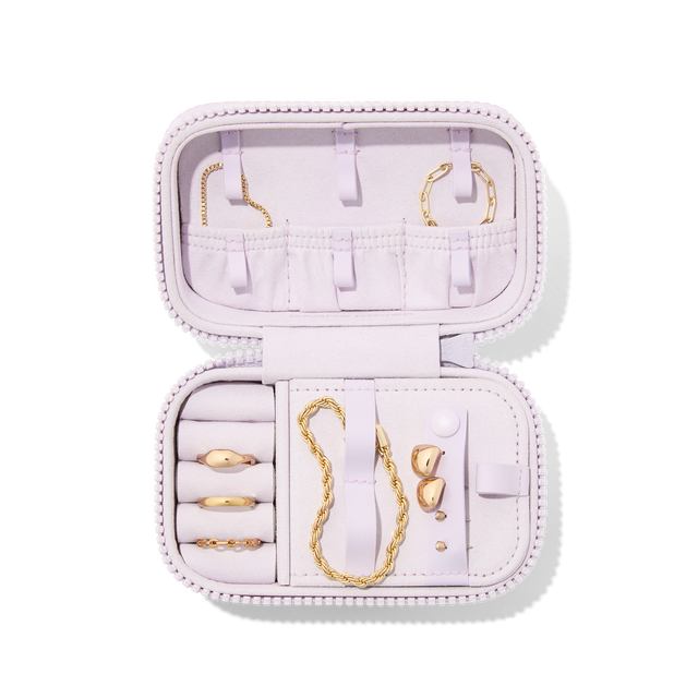 Dagne Dover Small Frankie Jewelry Case in a custom washed lilac and cream floral print, seen open from above with jewelry inside and the interior compartment closed. hover
