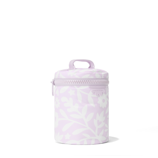 Dagne Dover large Mila Toiletry Pouch in a custom washed lilac and cream floral print seen from an angle.
