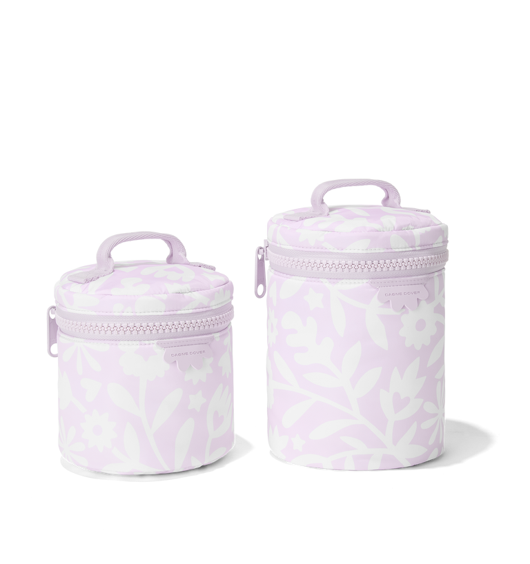 Dagne Dover small and large Mila Toiletry Pouches in a custom washed lilac and cream floral print.
