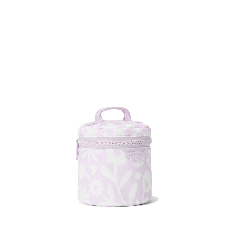 Dagne Dover small Mila Toiletry Pouch in a custom washed lilac and cream floral print seen from an angle.
