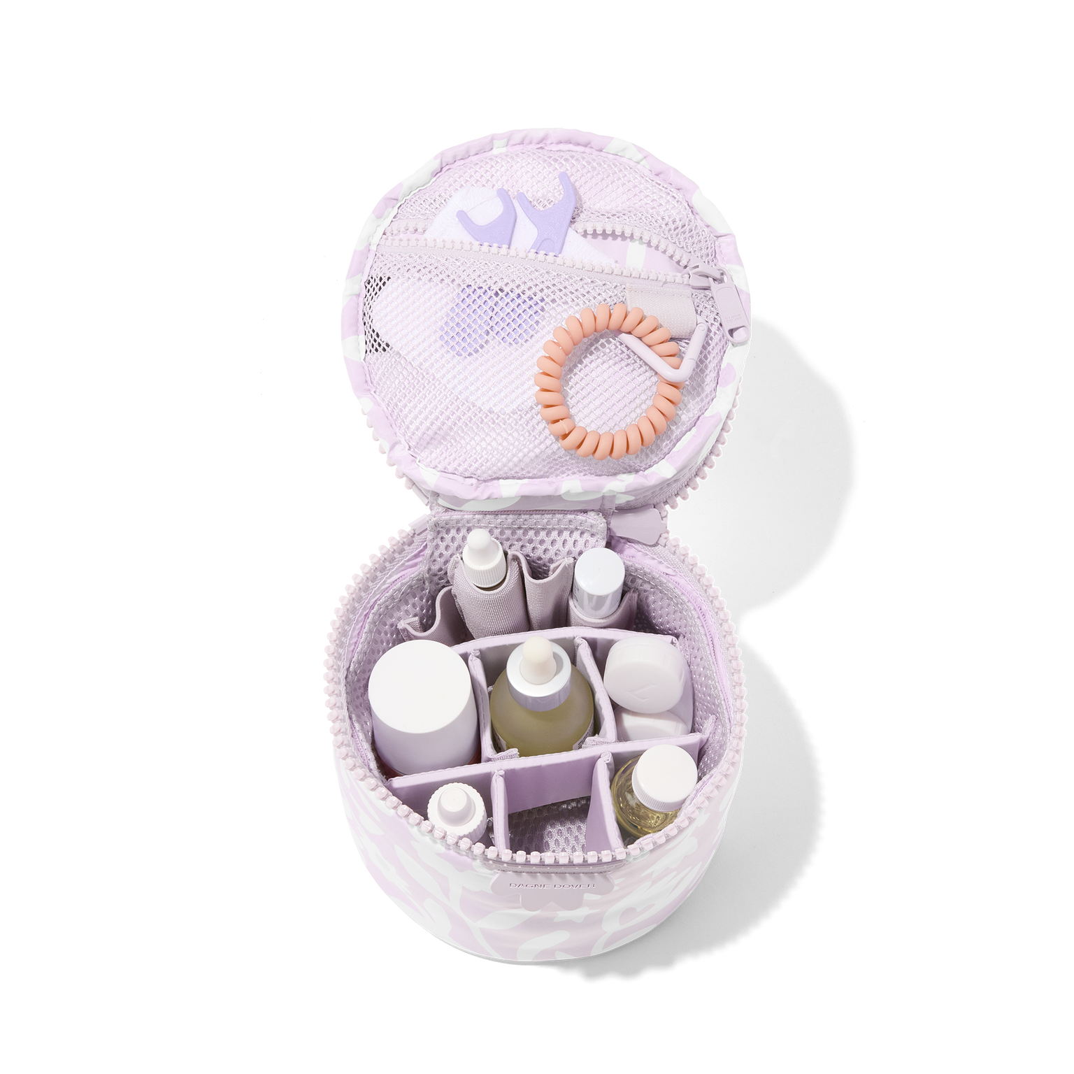 Dagne Dover small Mila Toiletry Pouch in a custom washed lilac and cream floral print unzipped filled with toiletry products. hover
