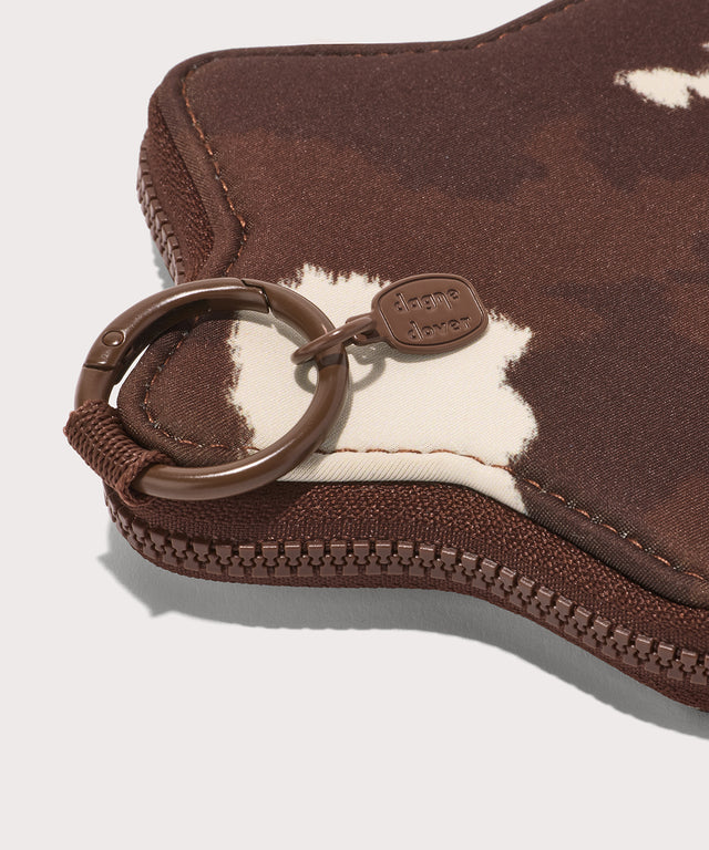Detail Dagne Dover Star Keychain in a cow print.