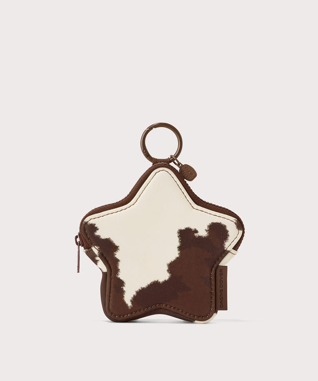 Dagne Dover Star Keychain in a cow print.