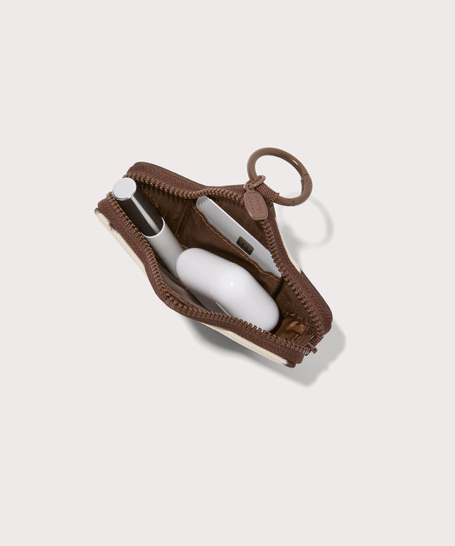 Dagne Dover Star Keychain seen from the top down in a cow print.