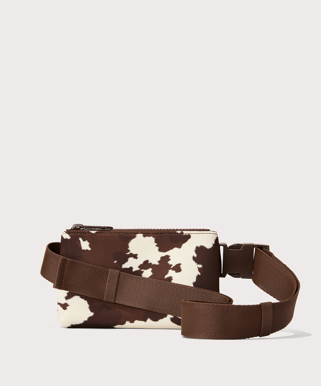 Dagne Dover Bennie Sling in a cow print as seen from the back view.