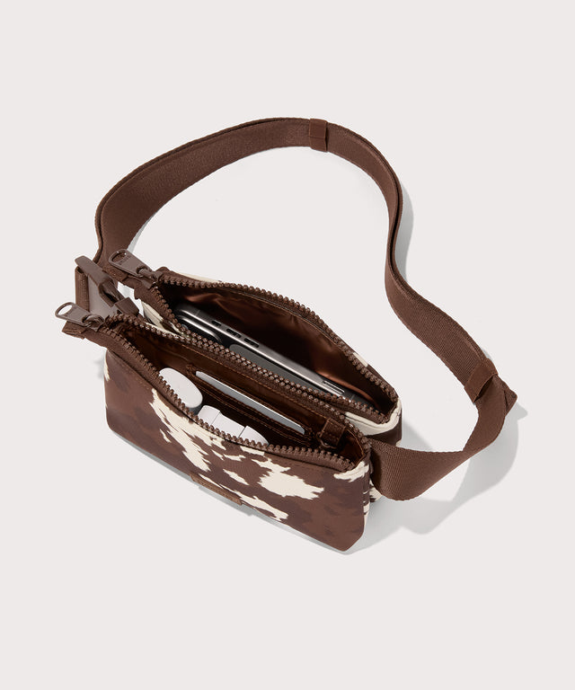 Dagne Dover Bennie Sling in a cow print as seen from the top down view.