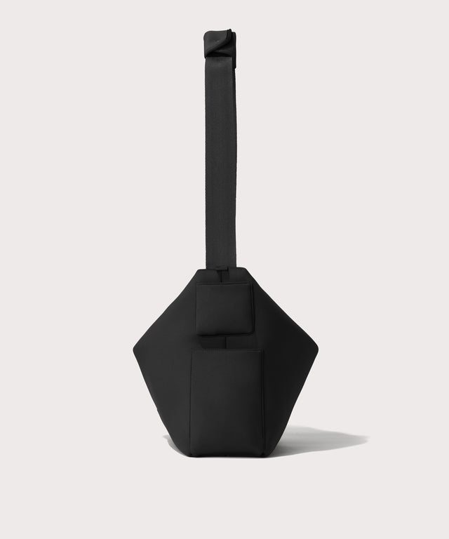 Large Shoulder bag in a black seen from the side view showing phone pocket.
