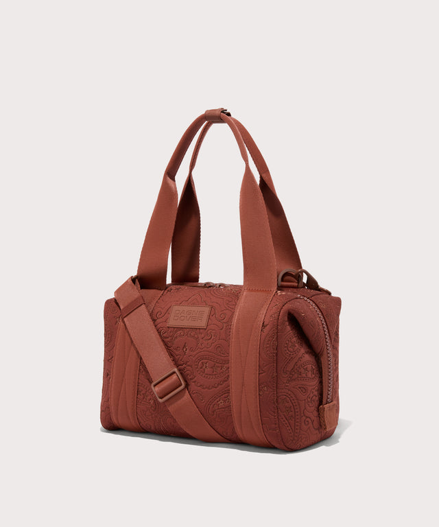 Dagne Dover Small Landon Carryall in a rich, warm brown with an embroidered paisley print seen from an angle.
