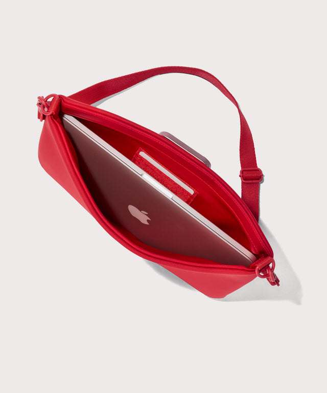 Large  Shoulder bag in a fiery, saturated red leaning toward orange seen from the top down view showing interior.
