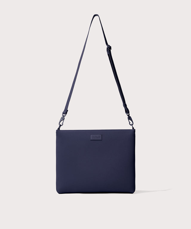14 inch laptop shoulder bag in  navy blue seen from the front view. 
