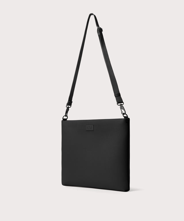 16 inch laptop shoulder bag in a black seen from the angle.