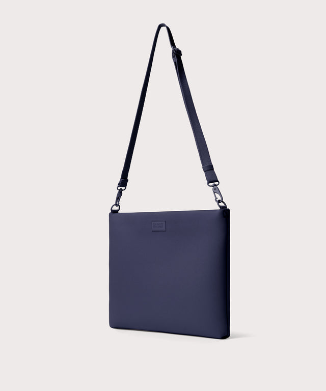16 inch laptop shoulder bag in navy blue seen from the angle view .