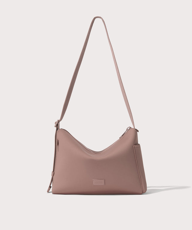 Shoulder bag in a pink seen from the front view. 
