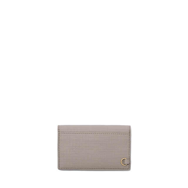 Dagne Dover vegan Card Case in beige seen from the back revealing the one external card slot.