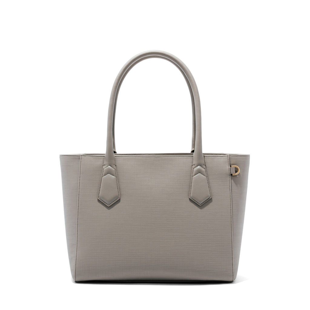 Large-sized tote bag with tonal colors & high shine metal logo on the  front. Top zip closure for safety and flat shoulder handles for comfort.  This handbag has spacious compartment and multi-utility