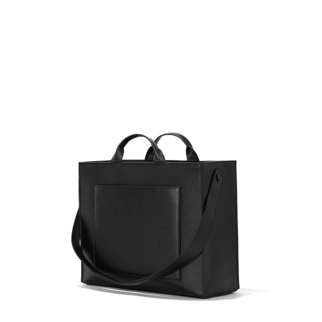 Dagne Dover medium vegan Daily Tote in black seen from an angle.