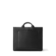 Dagne Dover medium vegan Daily Tote in black revealing the exterior phone pocket and exterior luggage sleeve.