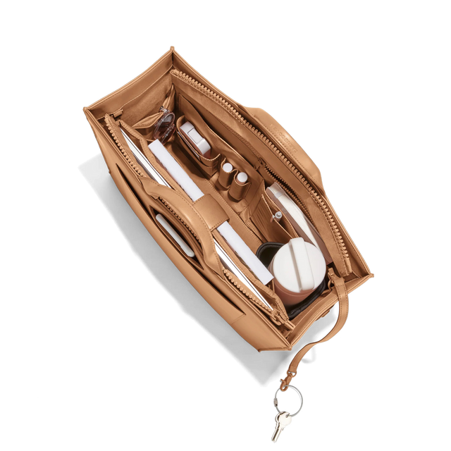 hover - Dagne Dover large vegan Daily Tote in brown from above, revealing the interior zipper, interior slip pockets, and padded laptop sleeve.