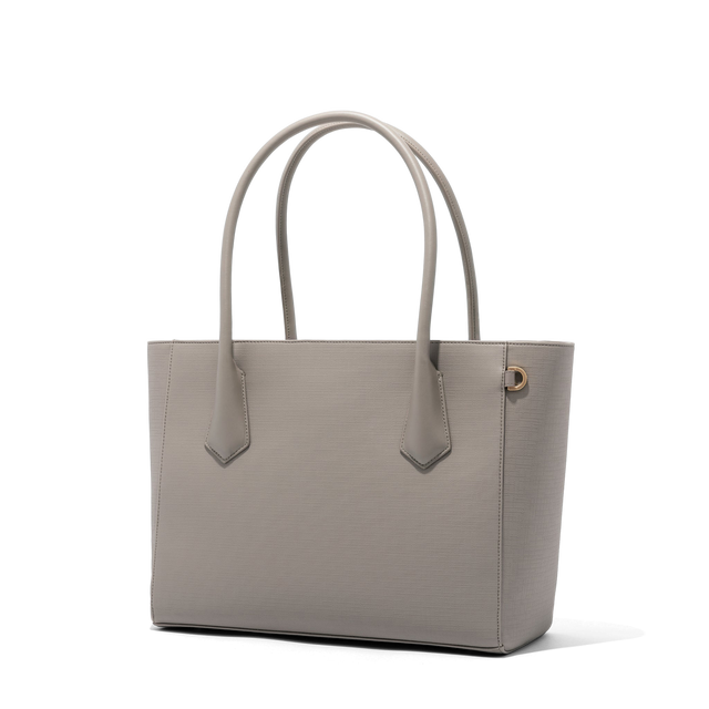 Dagne Dover Legend Signature Leather Tote in beige seen from an angle.