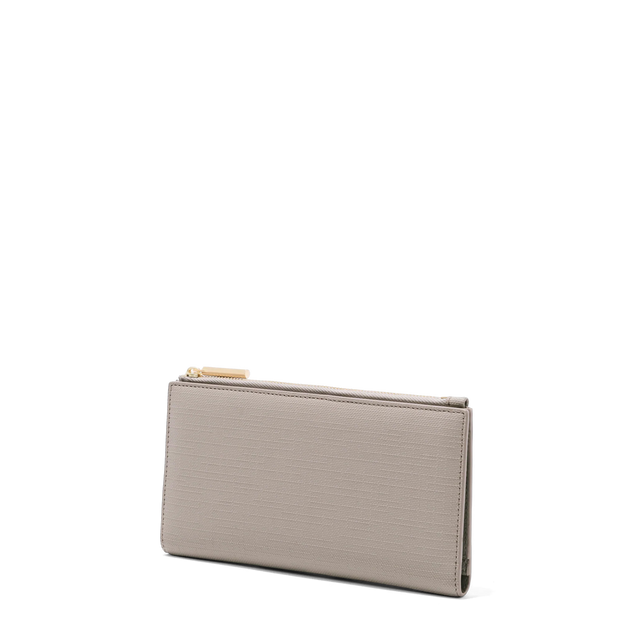 Dagne Dover Slim Wallet in beige seen from an angle.