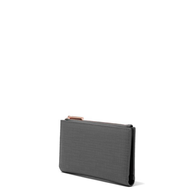Dagne Dover Slim Wallet in grey seen from an angle.