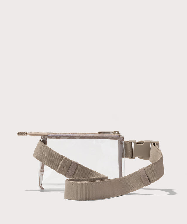 Clear belt bag with a beige starp on a white background. Stadium compliant. 