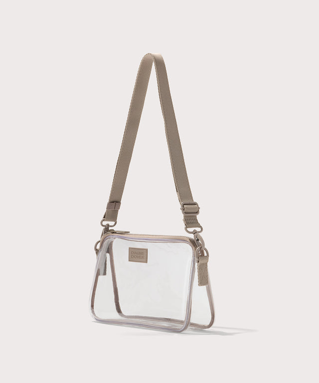 Clear crossbody bag with a beige strap on a white background. Stadium compliant. 