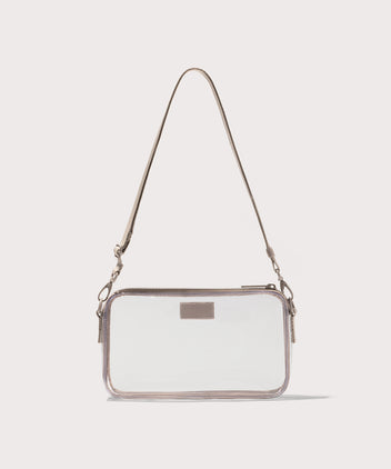 Clear crossbody bag with a beige strap on a white background. Stadium compliant.