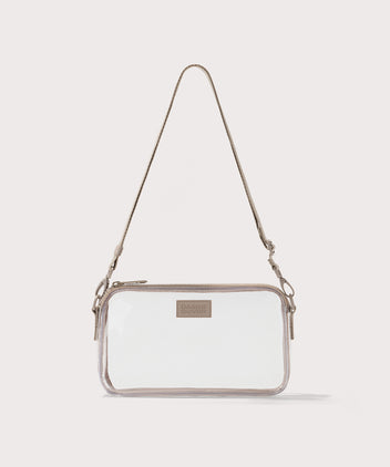 Clear crossbody bag with beige strap on a white background. Stadium compliant. 