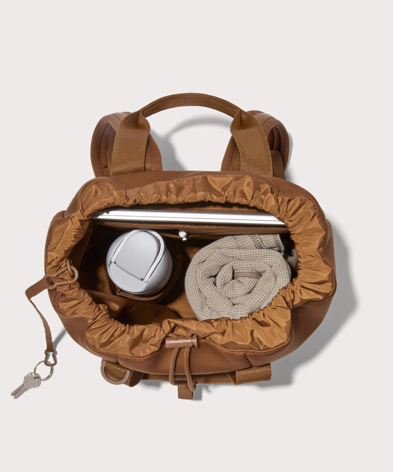 Rhys in a saturated, warm medium-brown with burnt orange undertones unzipped, top down view. 
