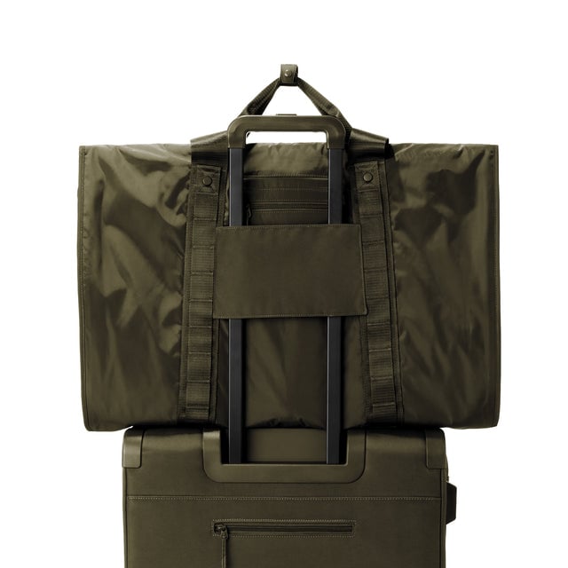 Back view of Capri garment bag in dark moss on luggage handle