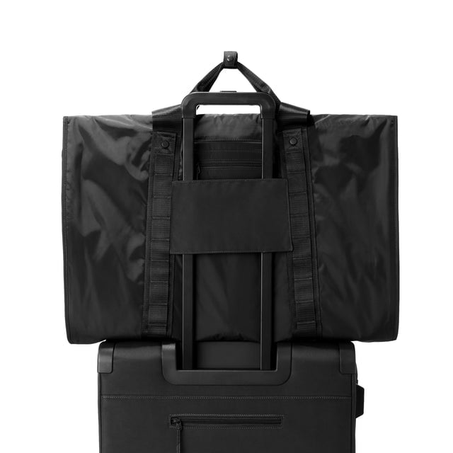 Back view of Capri garment bag in onyx on luggage handle