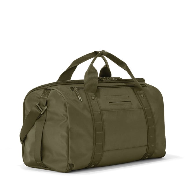 3/4 back view of Monaco garment duffle in dark moss showing back zippered tech pocket and phone/passport pockets