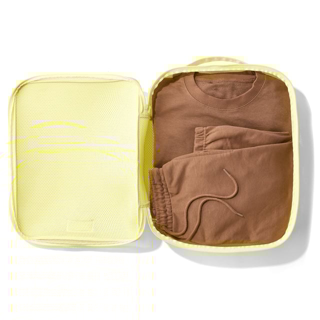3/4 view of Extra Large Roma packing cube in citrine yellow.