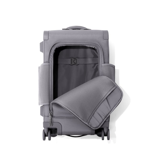 Top down of Seattle carry-on rolling luggage 23.5” in ash with front flap opened. 