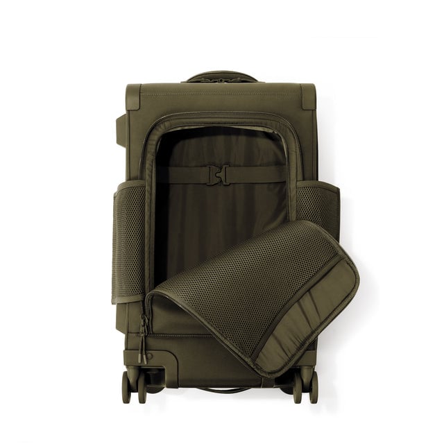 Top down of Seattle carry-on rolling luggage 23.5” in dark moss with front flap opened. 