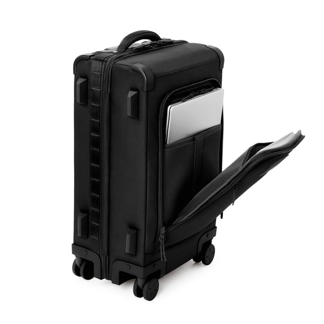 ¾ front view of Seattle carry-on rolling luggage 23.5” in onyx with front flap opened. Caption: Interior slip pocket fits most 16