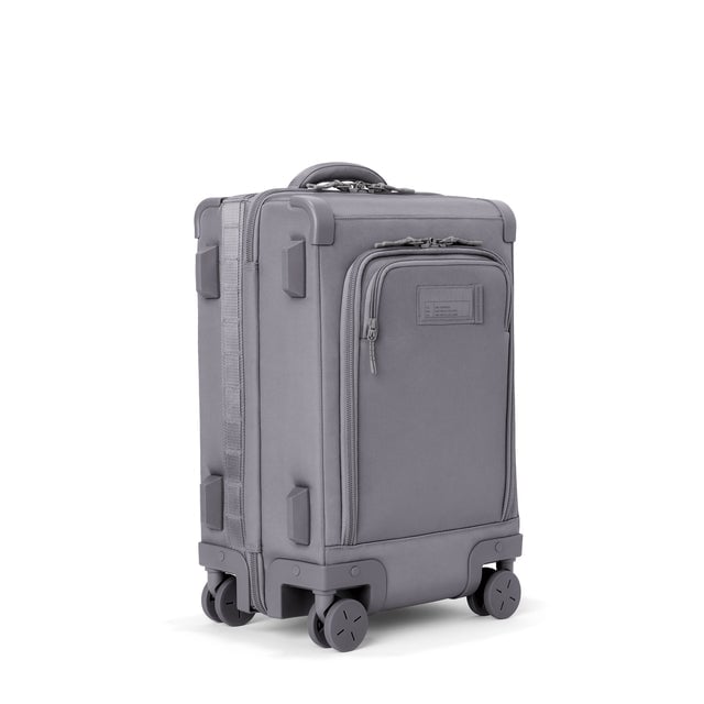 3/4 front view of Seattle carry-on rolling luggage 20.5” in ash showing side luggage feet