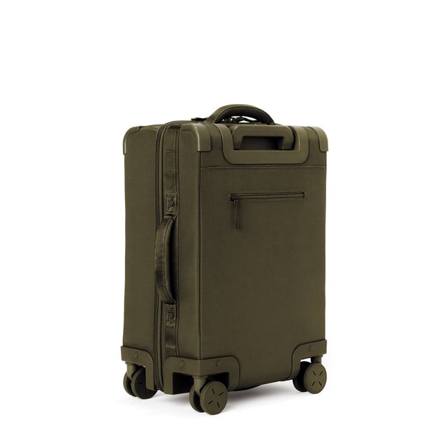 3/4 back view of Seattle carry-on rolling luggage 20.5” in dark moss showing side handle and back zippered phone/passport pocket