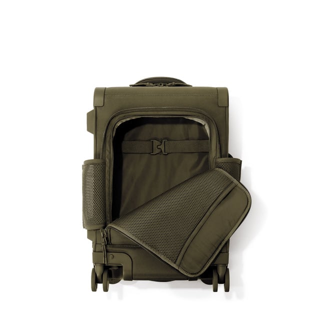 Top down of Seattle carry-on rolling luggage 20.5” in dark moss with front flap opened. 