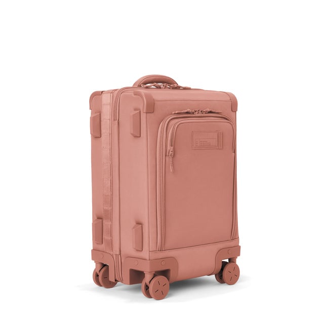 3/4 front view of Seattle carry-on rolling luggage 20.5” in warm dust showing side luggage feet