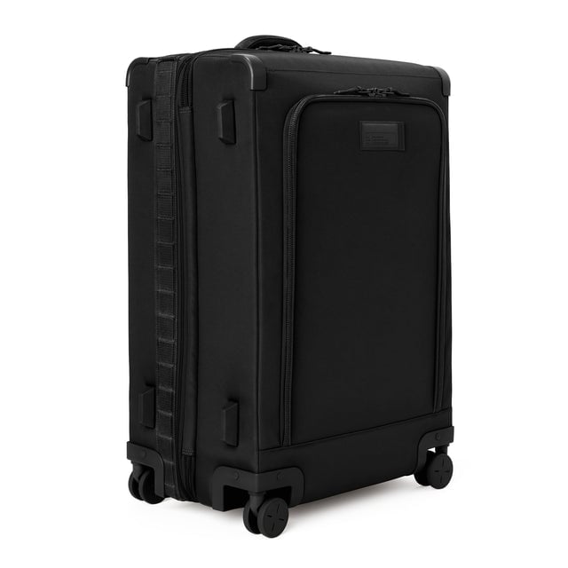 3/4 front view of Sydney checked rolling luggage 28.5” in onyx showing side luggage feet