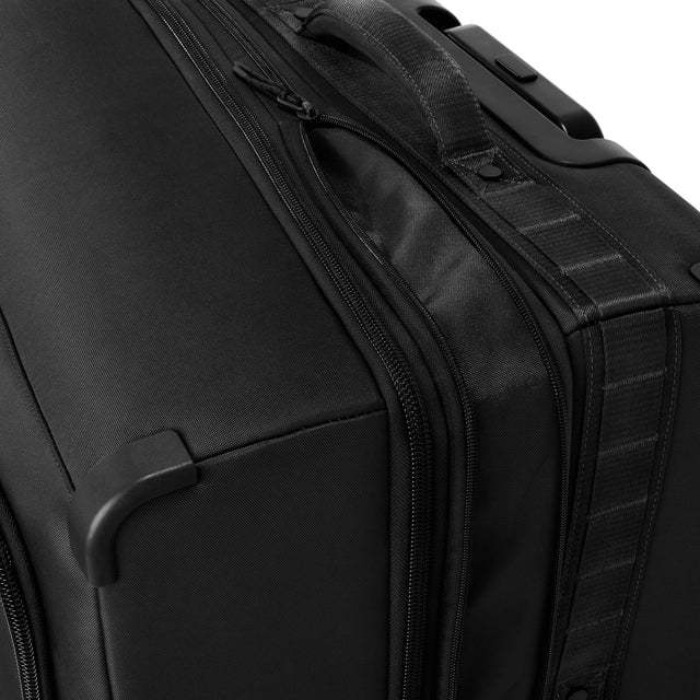 Detail shot of Sydney checked rolling luggage 28.5” in onyx expandable zipper feature