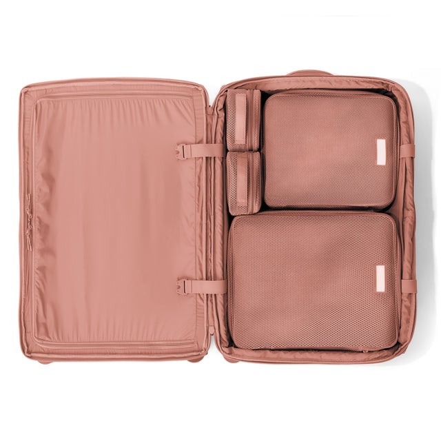 Top down of Sydney checked rolling luggage 28.5” in warm dust with interior divider zipped and packing cubes packed into the right side. hover