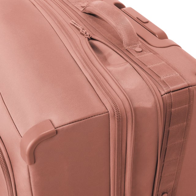 Detail shot of Sydney checked rolling luggage 25” in warm dust expandable zipper feature