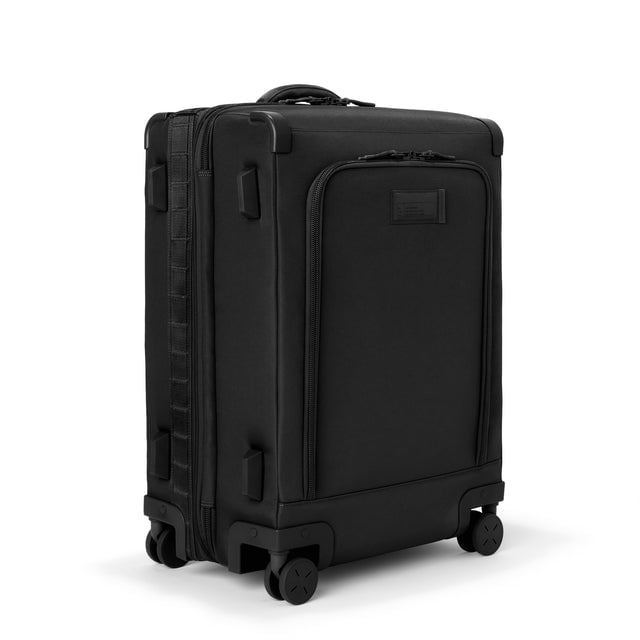 3/4 front view of Sydney checked rolling luggage 25” in onyx showing side luggage feet