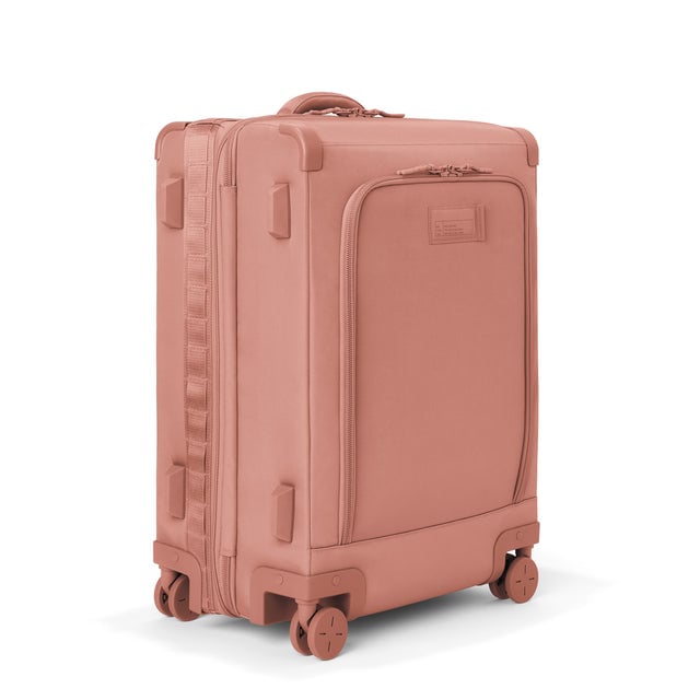 3/4 front view of Sydney checked rolling luggage 25” in warm dust showing side luggage feet