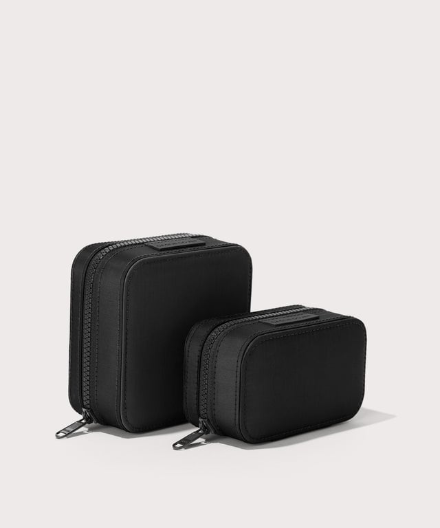 Dagne Dover Small and Large Frankie Jewelry Cases in black standing next to one another.
