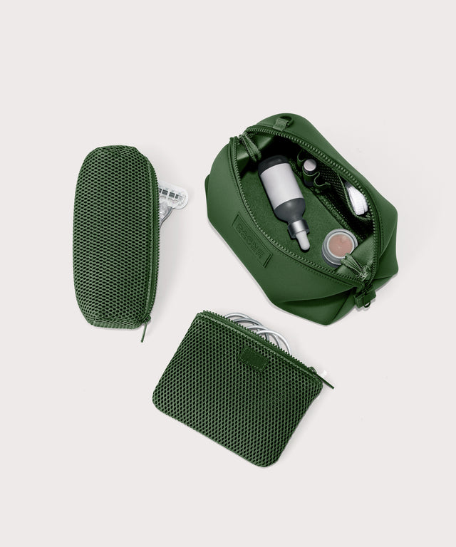 Dagne Dover Large Hunter Toiletry Bag in a rich, classic forest green. unzipped and seen from above with the removable air mesh pouch alongside it.